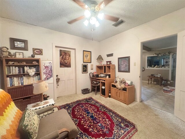 706 W St, Yoakum, TX 77995 - office area with ceiling fan, carpet, and a textured ceiling