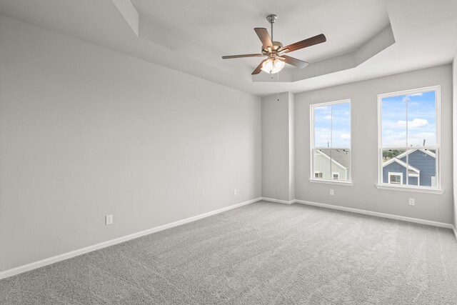 3022 Ventas Dr, Houston, TX 77047 - carpeted spare room with baseboards, a tray ceiling, and a ceiling fan