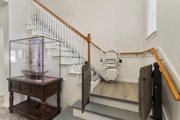 23706 River Place Dr, Katy, TX 77494 - staircase with a high ceiling and baseboards