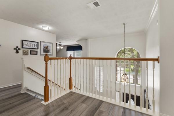 23706 River Place Dr, Katy, TX 77494 - hall featuring an upstairs landing, wood finished floors, and a chandelier