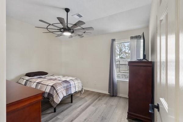23706 River Place Dr, Katy, TX 77494 - bedroom with light wood-type flooring, ceiling fan, and baseboards