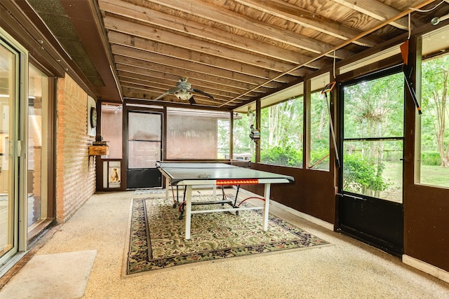 6915 Oak Bend Dr, Alvin, TX 77511 - playroom with a ceiling fan, baseboards, and brick wall