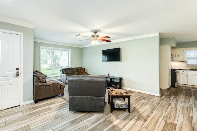 6915 Oak Bend Dr, Alvin, TX 77511 - living area with wood tiled floors, ceiling fan, plenty of natural light, and ornamental molding