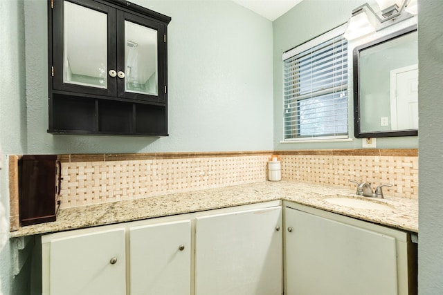 6915 Oak Bend Dr, Alvin, TX 77511 - bathroom with decorative backsplash and vanity