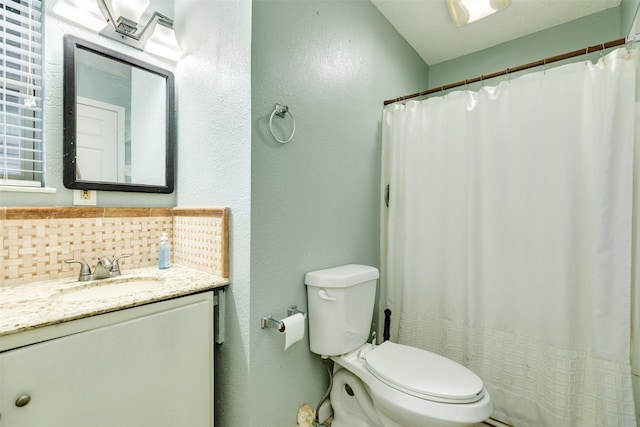 6915 Oak Bend Dr, Alvin, TX 77511 - full bath with backsplash, toilet, a textured wall, vanity, and a shower with curtain