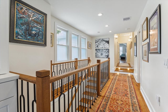 523 W 15th St, Houston, TX 77008 - corridor with an upstairs landing, light wood-style flooring, and recessed lighting