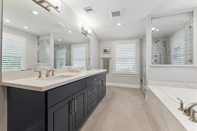 523 W 15th St, Houston, TX 77008 - full bath featuring a stall shower, double vanity, a bath, recessed lighting, and tile patterned flooring