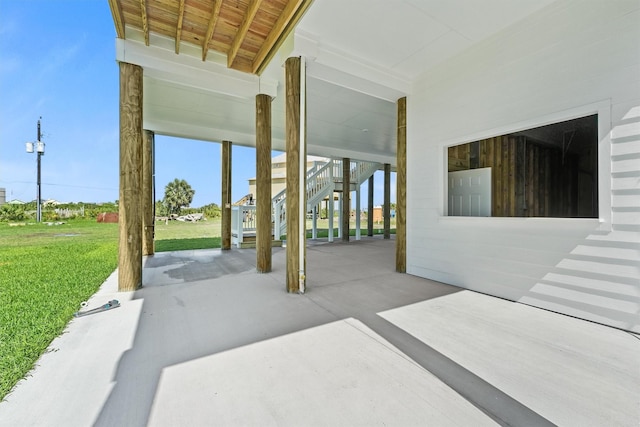 4010 Miramar Ct, Galveston, TX 77554 - view of patio with stairway and a carport