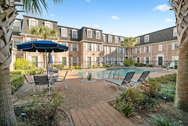 355 N Post Oak Ln Unit 743, Houston, TX 77024 - community pool featuring a patio area