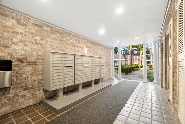 355 N Post Oak Ln Unit 743, Houston, TX 77024 - surrounding community with a wall of windows, recessed lighting, brick wall, and ornate columns