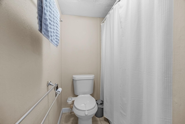 355 N Post Oak Ln Unit 743, Houston, TX 77024 - bathroom featuring toilet, tile patterned floors, and curtained shower