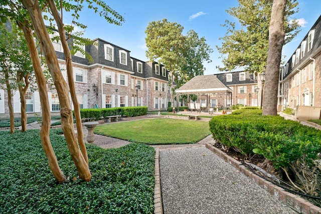 355 N Post Oak Ln Unit 743, Houston, TX 77024 - view of community with a residential view, a gazebo, and a yard
