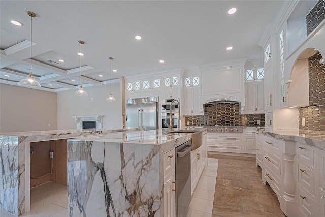 8522 Haven Trl, Tomball, TX 77375 - kitchen featuring stainless steel appliances, recessed lighting, a spacious island, white cabinets, and glass insert cabinets