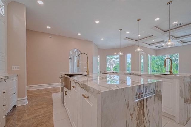 8522 Haven Trl, Tomball, TX 77375 - kitchen with a spacious island, a sink, plenty of natural light, recessed lighting, and coffered ceiling