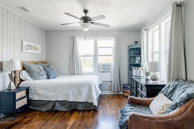 701 Gilchrist, College Station, TX 77840 - bedroom featuring wood finished floors, cooling unit, ceiling fan, and ornamental molding