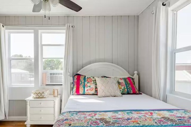 701 Gilchrist, College Station, TX 77840 - bedroom with multiple windows, cooling unit, and ceiling fan