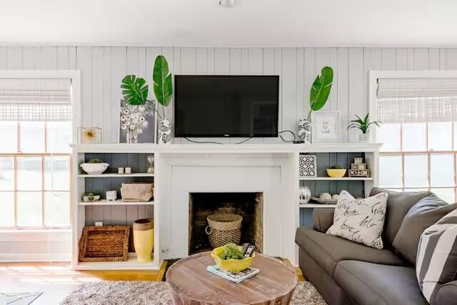 701 Gilchrist, College Station, TX 77840 - living area with plenty of natural light and a fireplace