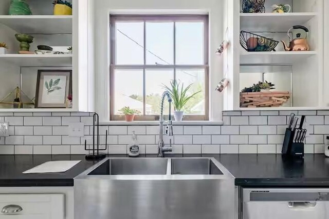 701 Gilchrist, College Station, TX 77840 - kitchen featuring dark countertops, dishwashing machine, and open shelves