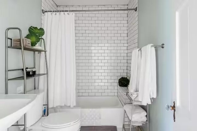 701 Gilchrist, College Station, TX 77840 - bathroom with toilet and shower / tub combo with curtain