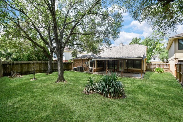 16323 Elmwood Point Ln, Sugar Land, TX 77498 - view of yard with central air condition unit, a sunroom, and a patio