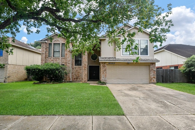 16323 Elmwood Point Ln, Sugar Land, TX 77498 - view of front facade with driveway, an attached garage, and brick siding