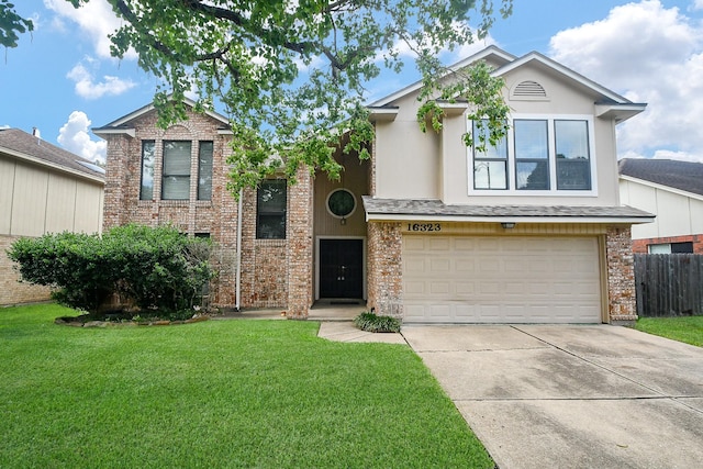 16323 Elmwood Point Ln, Sugar Land, TX 77498 - view of front of property featuring an attached garage, driveway, brick siding, and stucco siding