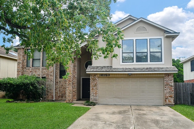 16323 Elmwood Point Ln, Sugar Land, TX 77498 - view of front of house with an attached garage, concrete driveway, and brick siding