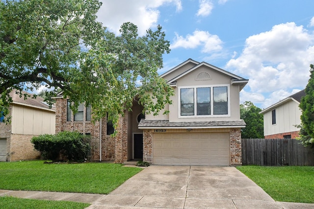 16323 Elmwood Point Ln, Sugar Land, TX 77498 - view of front of home featuring a garage, concrete driveway, and stucco siding
