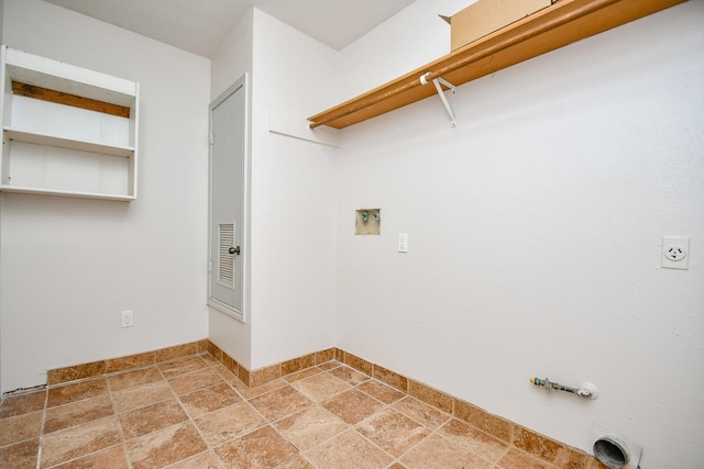16323 Elmwood Point Ln, Sugar Land, TX 77498 - laundry area with gas dryer hookup, stone tile flooring, washer hookup, baseboards, and electric dryer hookup
