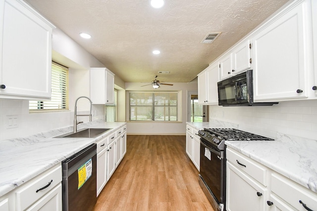 16323 Elmwood Point Ln, Sugar Land, TX 77498 - kitchen featuring black appliances, a sink, white cabinetry, a ceiling fan, and recessed lighting