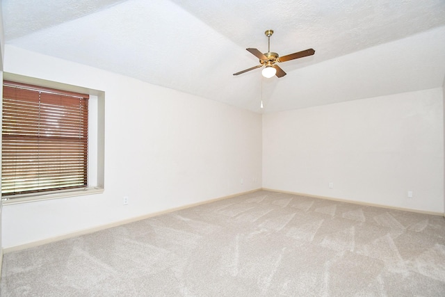 16323 Elmwood Point Ln, Sugar Land, TX 77498 - carpeted empty room featuring lofted ceiling, baseboards, and a ceiling fan