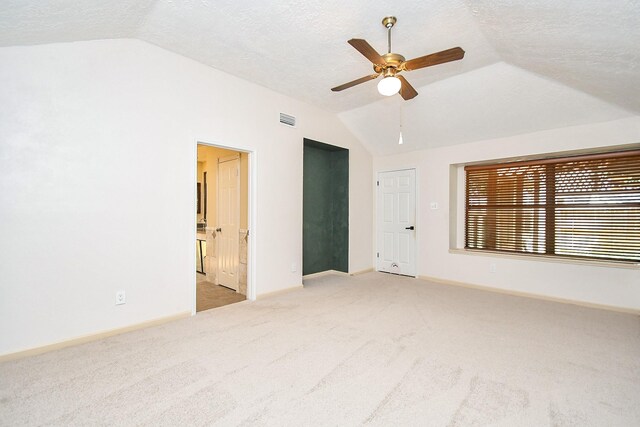 16323 Elmwood Point Ln, Sugar Land, TX 77498 - unfurnished room featuring vaulted ceiling, light carpet, a ceiling fan, baseboards, and a textured ceiling