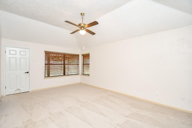 16323 Elmwood Point Ln, Sugar Land, TX 77498 - spare room featuring light colored carpet, a ceiling fan, lofted ceiling, and baseboards