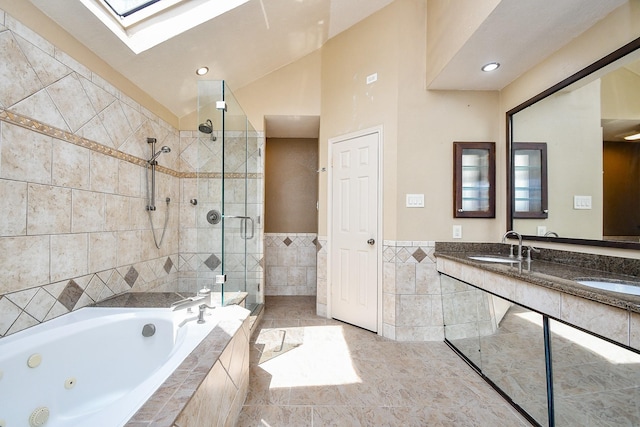 16323 Elmwood Point Ln, Sugar Land, TX 77498 - full bathroom featuring tile walls, a shower stall, a jetted tub, a skylight, and double vanity