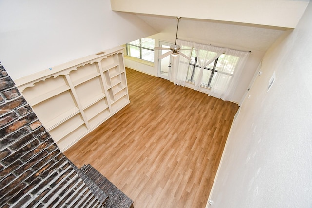 16323 Elmwood Point Ln, Sugar Land, TX 77498 - unfurnished living room featuring light wood finished floors, a ceiling fan, and baseboards