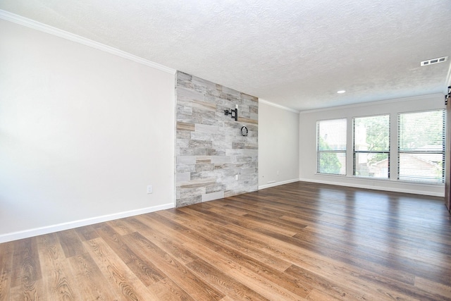 16323 Elmwood Point Ln, Sugar Land, TX 77498 - empty room featuring ornamental molding, a textured ceiling, wood finished floors, baseboards, and recessed lighting