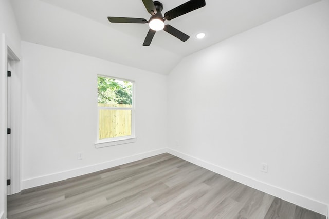 9406 Sandra St, Houston, TX 77016 - spare room with light wood-style floors, vaulted ceiling, ceiling fan, and recessed lighting