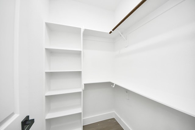 9406 Sandra St, Houston, TX 77016 - walk in closet featuring dark wood finished floors