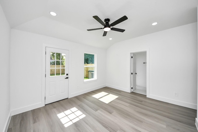 9406 Sandra St, Houston, TX 77016 - empty room with wood finished floors, a ceiling fan, recessed lighting, and vaulted ceiling