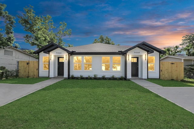 9406 Sandra St, Houston, TX 77016 - view of front of home with a gate and roof with shingles