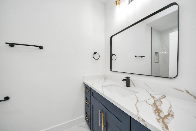 9406 Sandra St, Houston, TX 77016 - bathroom featuring vanity and marble look tiles