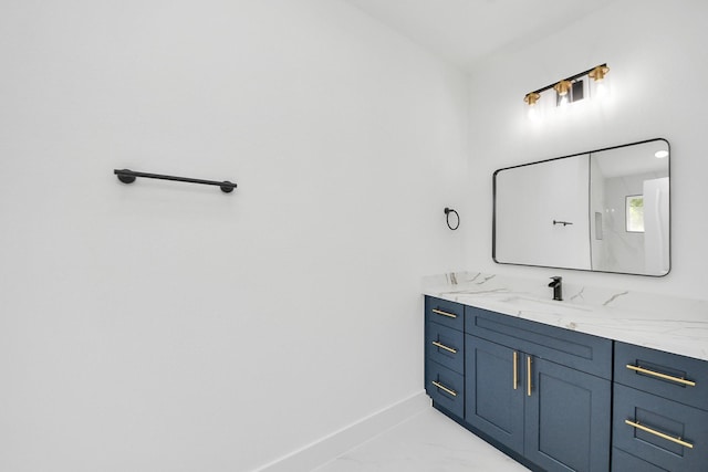 9406 Sandra St, Houston, TX 77016 - bathroom featuring vanity and marble look tiles