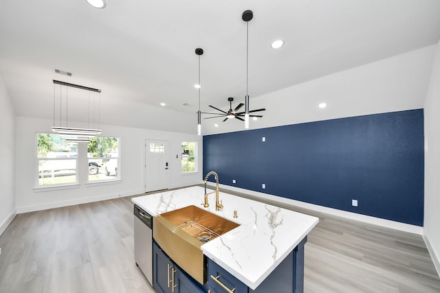 9406 Sandra St, Houston, TX 77016 - kitchen featuring dishwasher, open floor plan, blue cabinets, light wood-type flooring, and recessed lighting