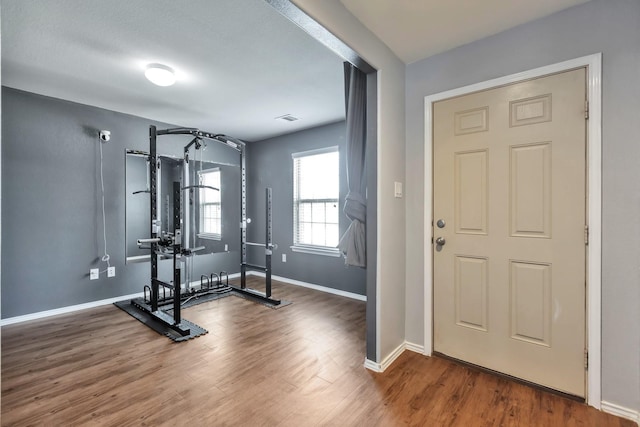 16531 Silla Ridge Ct, Houston, TX 77049 - workout room featuring wood finished floors and baseboards