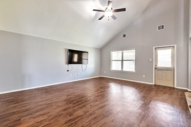 16531 Silla Ridge Ct, Houston, TX 77049 - unfurnished living room featuring a ceiling fan, high vaulted ceiling, plenty of natural light, dark wood finished floors, and baseboards