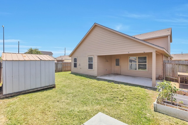 16531 Silla Ridge Ct, Houston, TX 77049 - rear view of property with a patio area and a vegetable garden