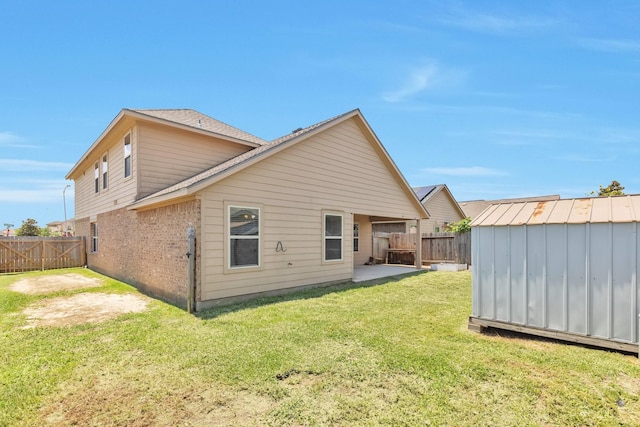 16531 Silla Ridge Ct, Houston, TX 77049 - back of house with brick siding and a patio