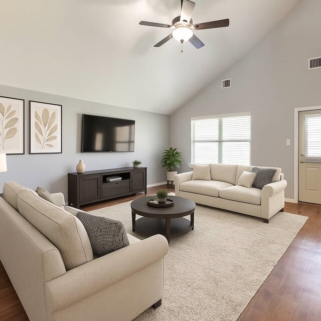 16531 Silla Ridge Ct, Houston, TX 77049 - living area featuring high vaulted ceiling, a ceiling fan, wood finished floors, and baseboards