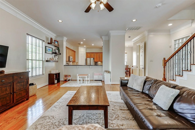 1529 Rosewood St, Houston, TX 77004 - living room with a ceiling fan, stairs, light wood finished floors, recessed lighting, and crown molding