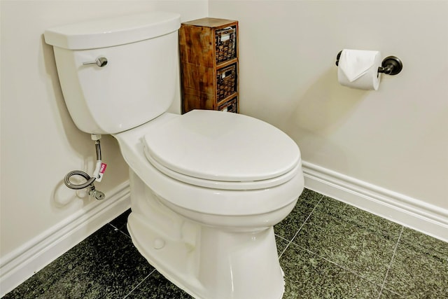 1529 Rosewood St, Houston, TX 77004 - bathroom with baseboards, toilet, and tile patterned flooring